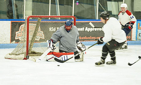 Veteran David Denhardt plays goalie for his Warrior Hockey team.
